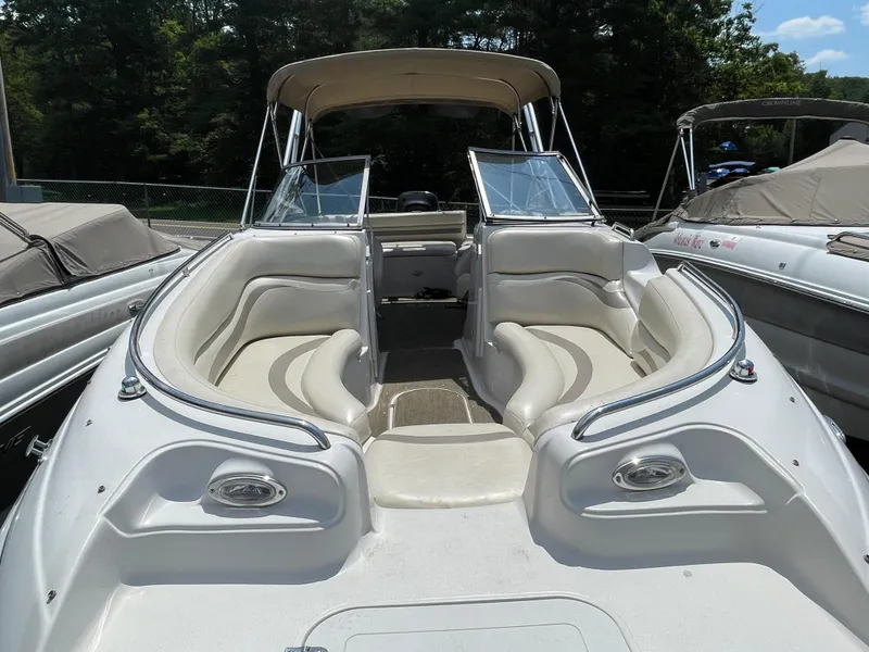 Slide: The Image of 2007 Starcraft 2410 OB Limited boat with spacious seating and canopy, docked outdoors. - 7