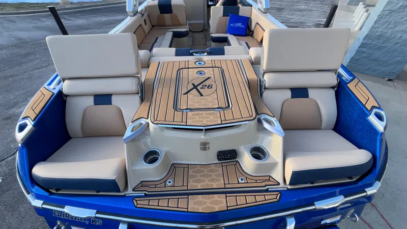 Slide: The Image of 2022 MasterCraft X26 boat interior with luxurious seating and stylish design. - 21