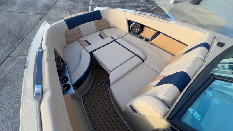Slide: The Image of 2022 MasterCraft X26 boat interior with luxurious seating and modern design. - 24