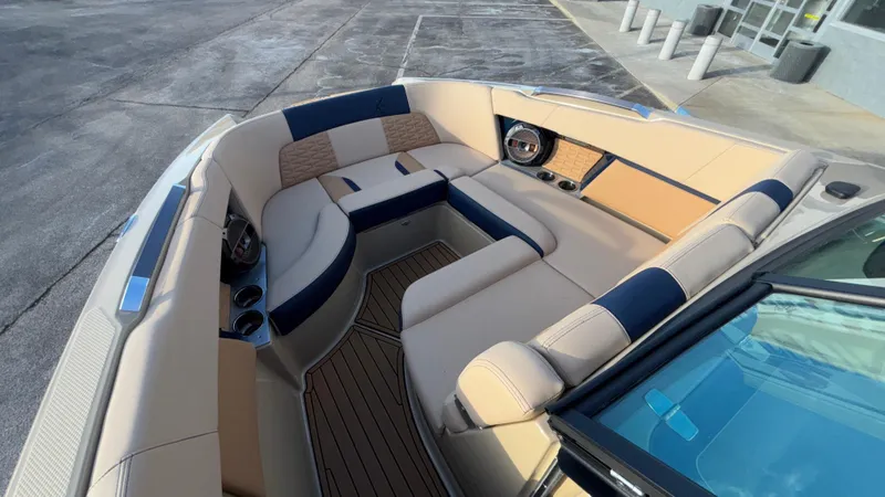 Slide: The Image of Luxurious interior of 2022 MasterCraft X26 boat with beige and navy seating. - 25