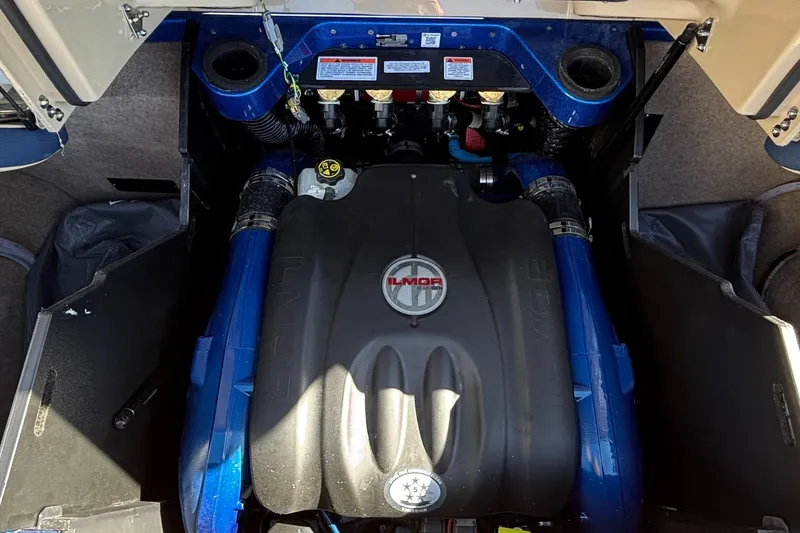 Slide: The Image of 2022 MasterCraft X26 engine compartment with Ilmor engine components. - 39