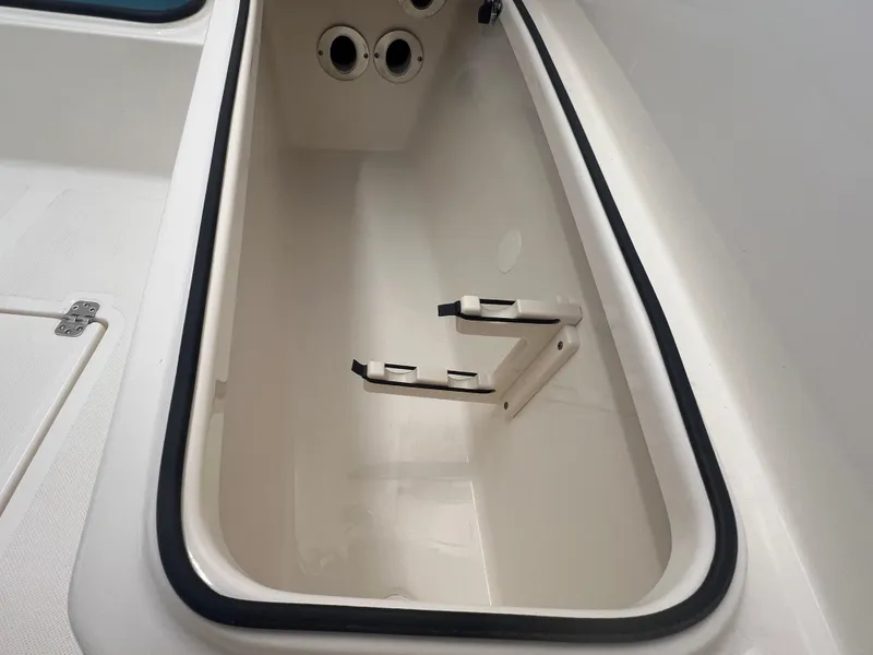 Slide: The Image of Storage compartment of 2026 Pioneer 220 Bay Sport boat, featuring sleek interior design. - 21