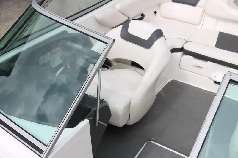 Slide: The Image of 2014 Yamaha Boats SX190 interior with white seating and windshield. - 15