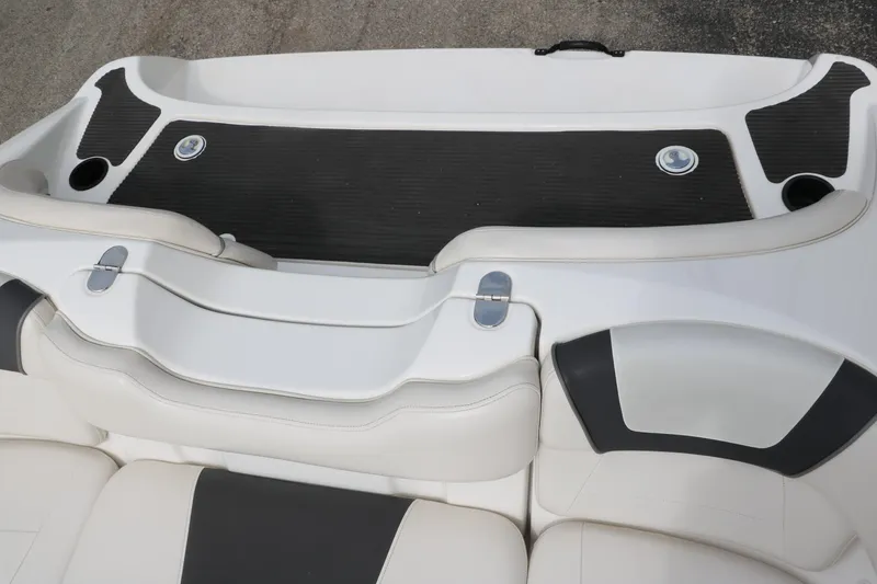 Slide: The Image of 2014 Yamaha Boats SX190 interior seating with black and white upholstery. - 19