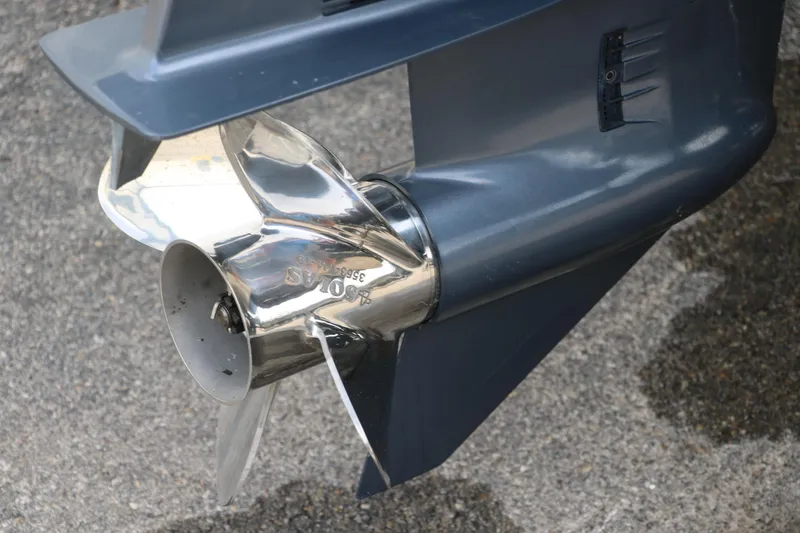 Slide: The Image of Close-up of a 2015 Stingray 192 SC boat propeller on pavement. - 13