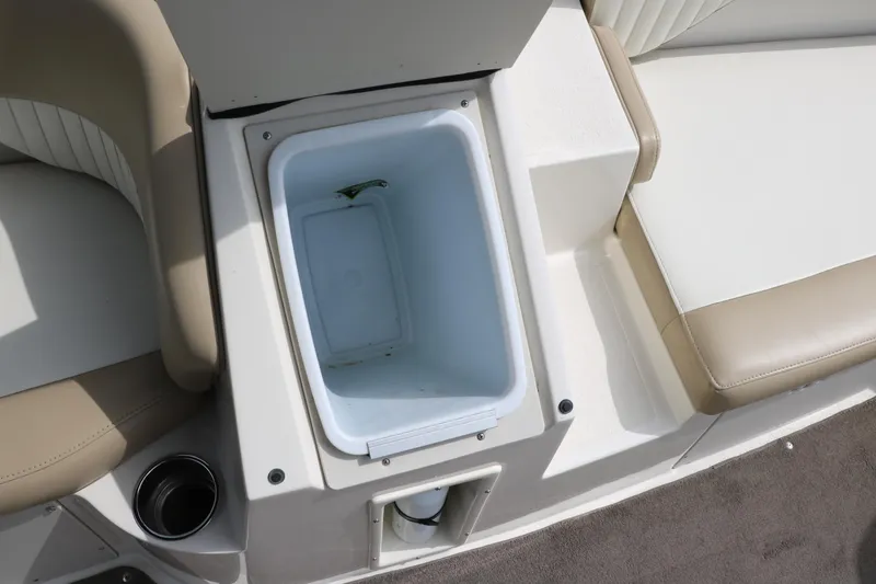Slide: The Image of 2015 Stingray 192 SC boat interior with built-in cooler and seating. - 31