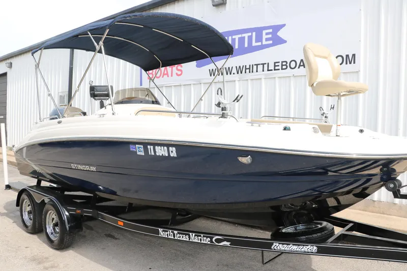 Slide: The Image of 2015 Stingray 192 SC boat on trailer at North Texas Marine dealership. - 5