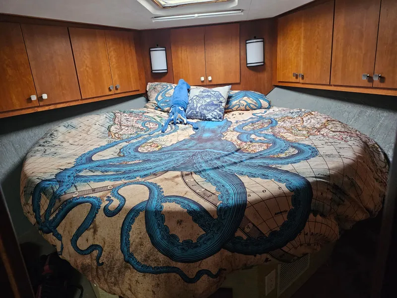 Slide: The Image of Cozy cabin bedroom in 1995 Silverton 46 yacht with octopus-themed bedding. - 15