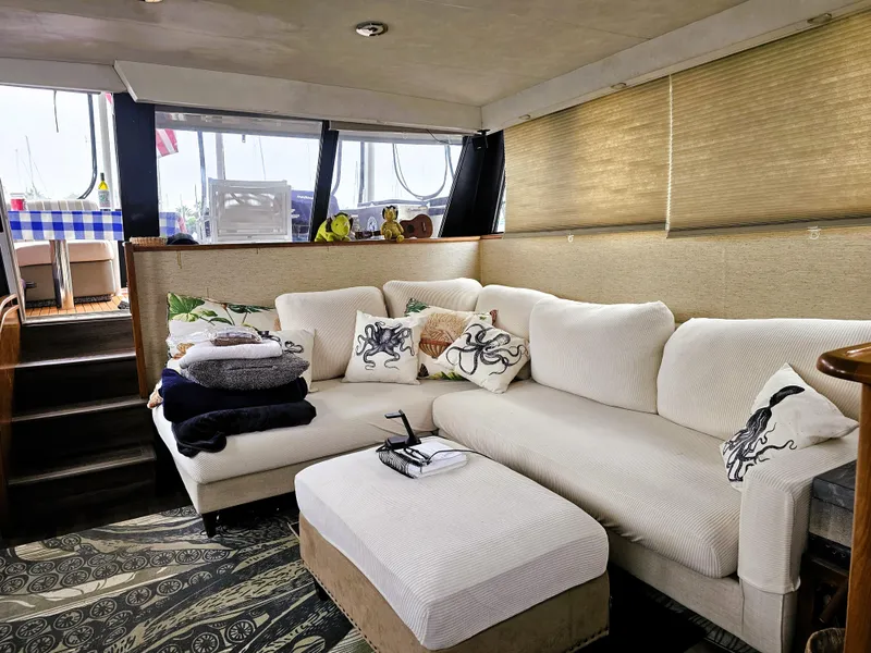 Slide: The Image of Luxurious interior of a 1995 Silverton 46 yacht with cozy seating and nautical decor. - 9