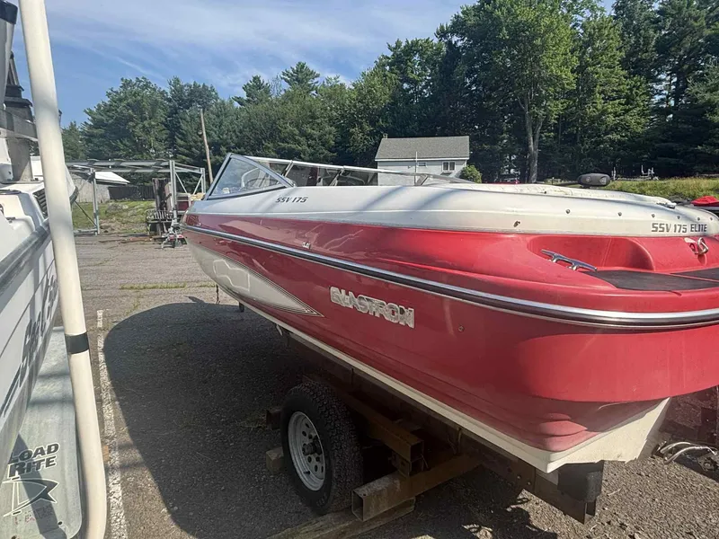 Slide: The Image of Red 1993 Glastron SSV 175 boat on trailer, parked outdoors. - 11