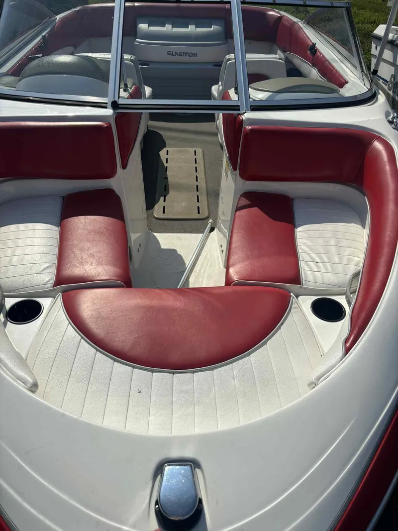 Slide: The Image of 1993 Glastron SSV 175 boat interior with red and white seating. - 15