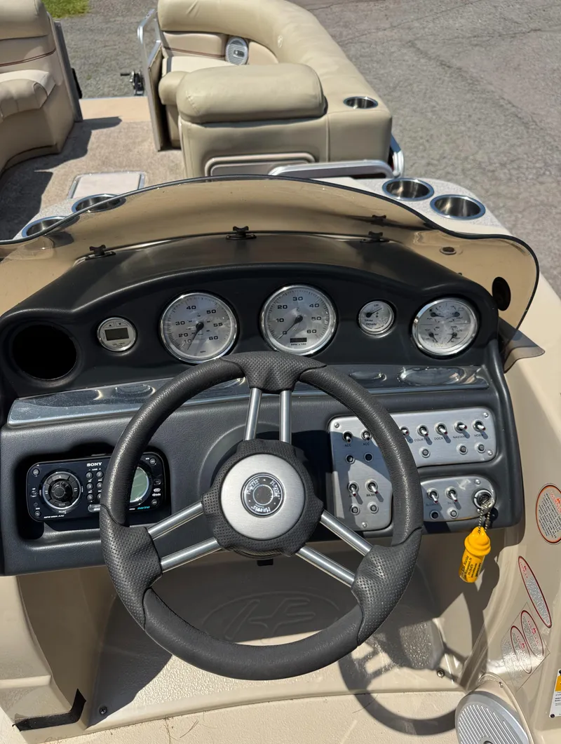 Slide: The Image of Steering console of 2011 Harris Grand Mariner SEL 250 boat with gauges and controls. - 6
