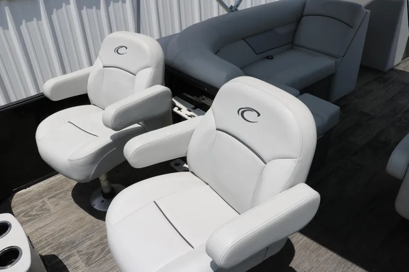 Slide: The Image of 2022 Crest Classic Fish 220 boat interior with white cushioned seats. - 16