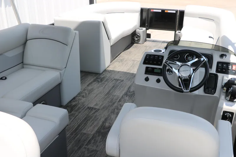 Slide: The Image of Interior of 2022 Crest Classic Fish 220 pontoon boat with modern seating and steering console. - 17