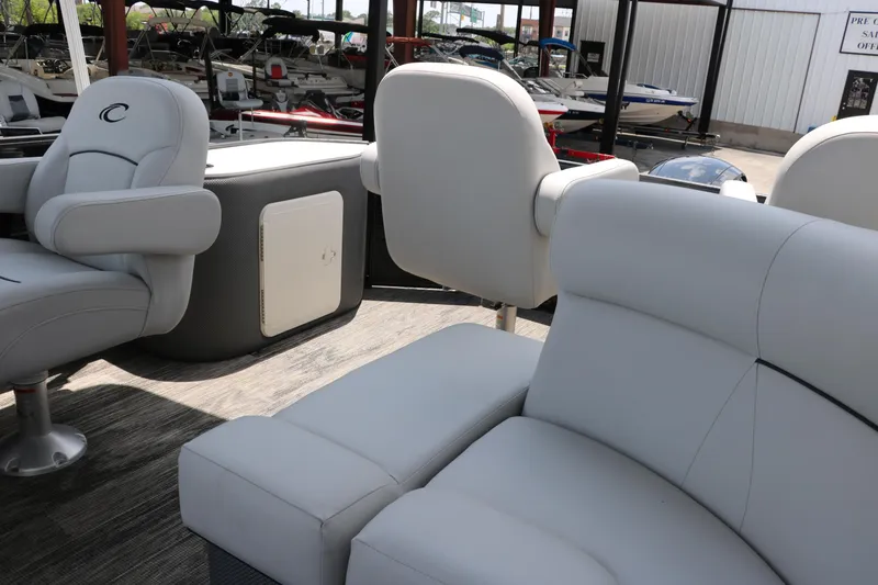 Slide: The Image of 2022 Crest Classic Fish 220 boat interior with plush seating and modern design. - 23