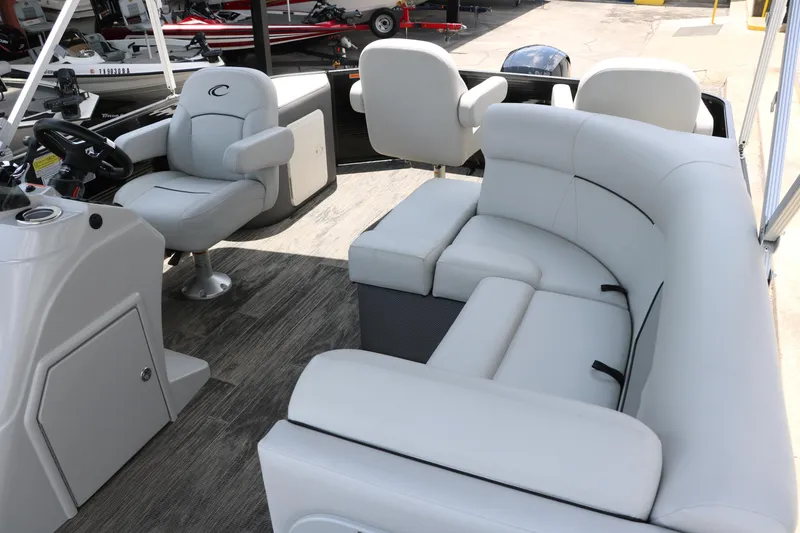 Slide: The Image of 2022 Crest Classic Fish 220 boat interior with plush seating and modern helm. - 25