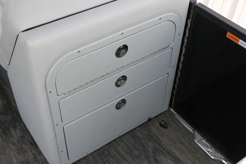 Slide: The Image of Interior storage drawers on 2022 Crest Classic Fish 220 boat. - 26