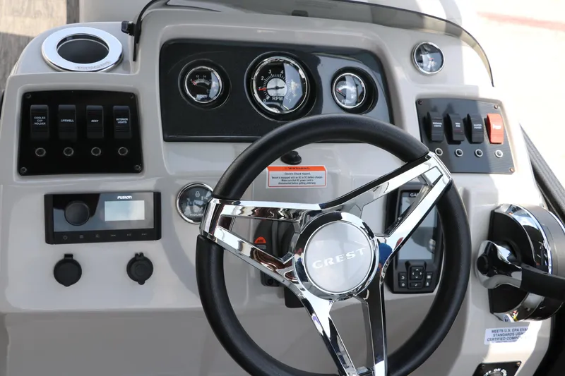 Slide: The Image of Steering console of 2022 Crest Classic Fish 220 boat with gauges and controls. - 28