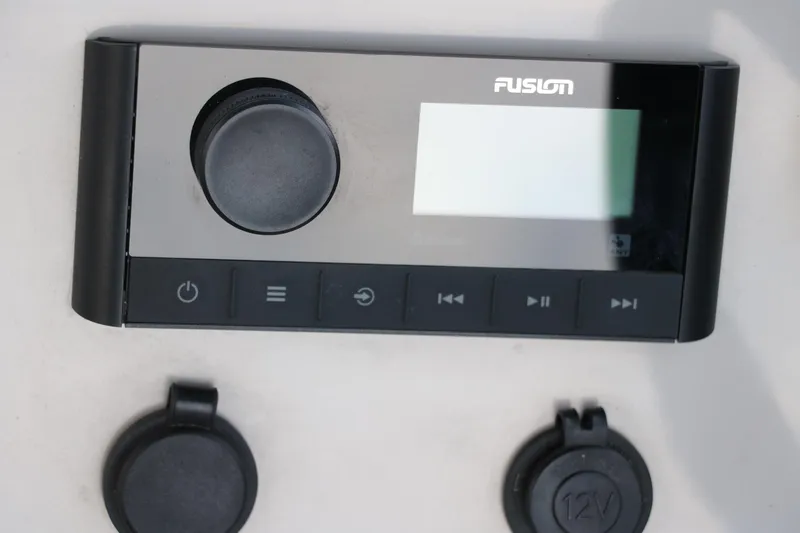 Slide: The Image of Control panel of a 2022 Crest Classic Fish 220 boat with Fusion audio system. - 29