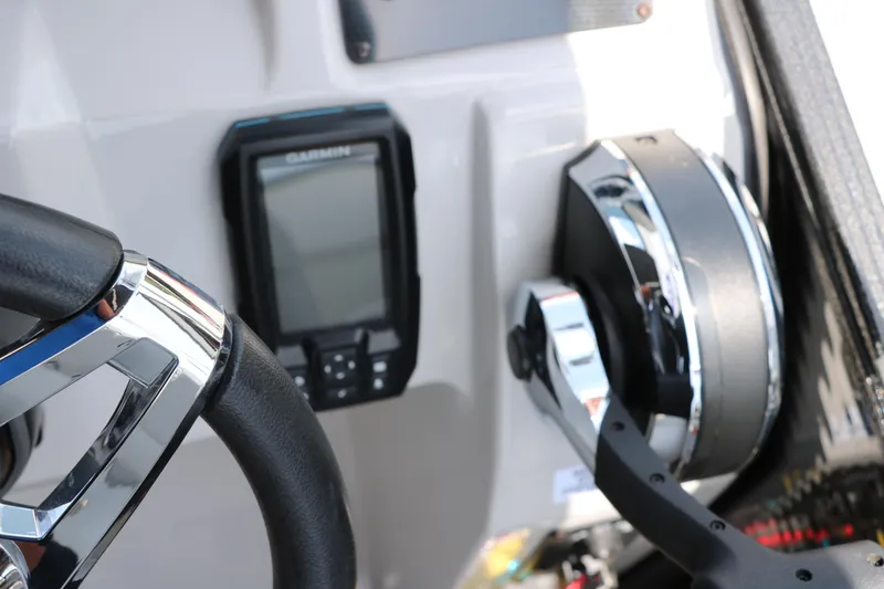 Slide: The Image of Steering wheel and controls of 2022 Crest Classic Fish 220 boat with Garmin device. - 30