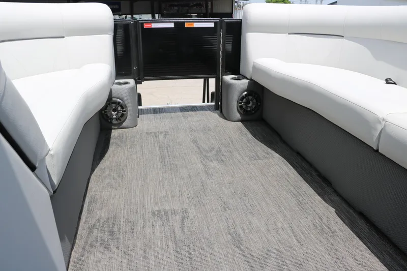 Slide: The Image of Interior of 2022 Crest Classic Fish 220 pontoon boat with white seating and speakers. - 37