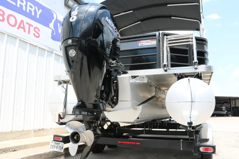 Slide: The Image of 2022 Crest Classic Fish 220 pontoon boat with Mercury outboard motor on trailer. - 5