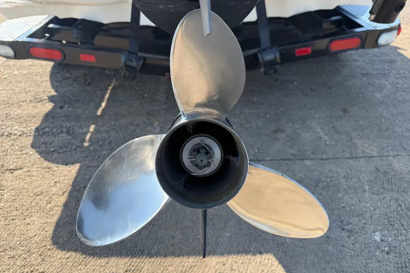 Slide: The Image of Close-up of a 2004 Skeeter ZX250 boat propeller on a trailer. - 11