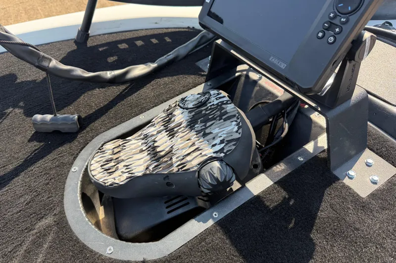 Slide: The Image of Foot pedal and fishfinder on 2004 Skeeter ZX250 boat deck. - 26