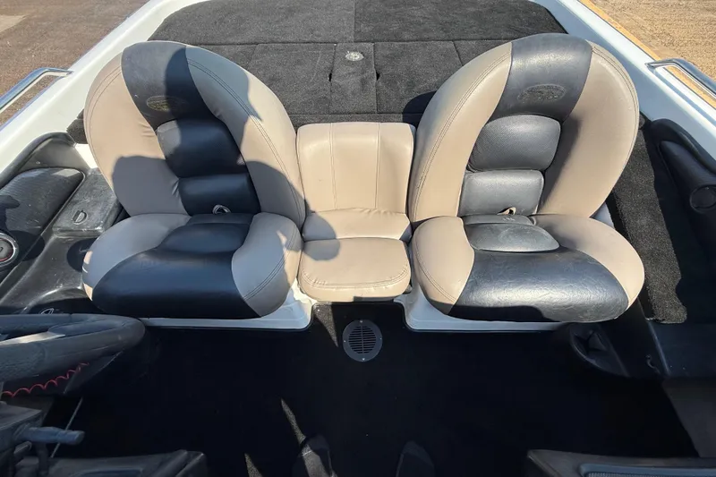 Slide: The Image of 2004 Skeeter ZX250 boat interior with dual-tone cushioned seats. - 56