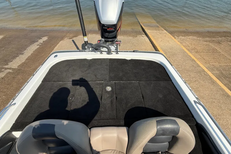 Slide: The Image of 2004 Skeeter ZX250 boat at a boat ramp, shadow of person taking photo. - 59