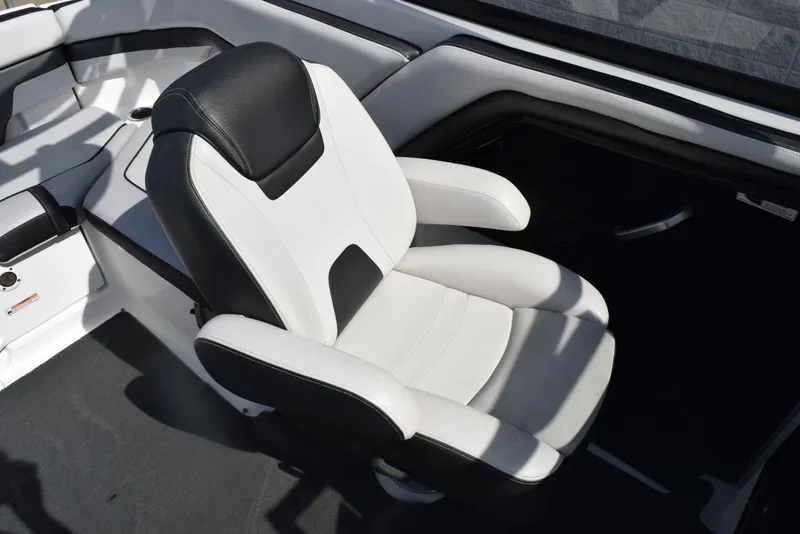 Slide: The Image of 2017 Yamaha Boats AR240 captain's chair, black and white upholstery, sleek design. - 11