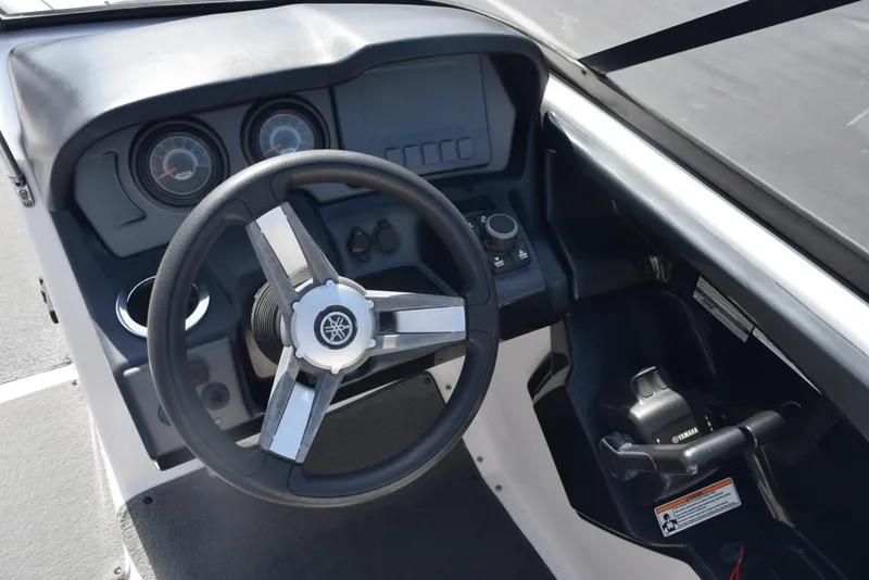 Slide: The Image of 2017 Yamaha AR240 boat dashboard with steering wheel and controls. - 13