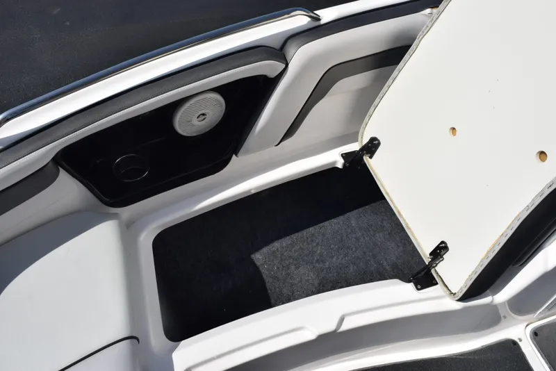 Slide: The Image of 2017 Yamaha AR240 boat storage compartment with open hatch and speaker. - 18