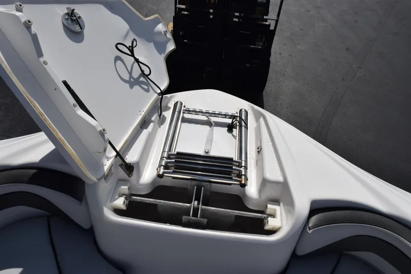Slide: The Image of 2017 Yamaha AR240 boat with open storage compartment and ladder. - 20