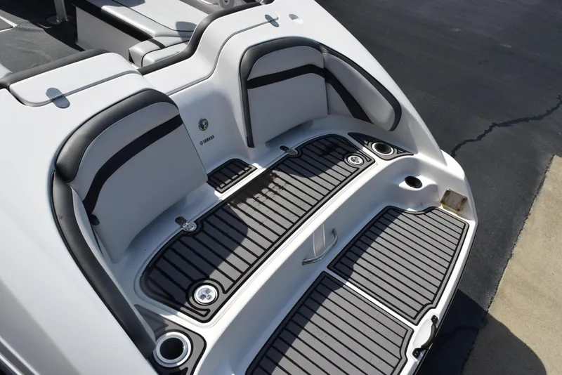 Slide: The Image of 2017 Yamaha AR240 boat swim platform with cushioned seating and non-slip flooring. - 7