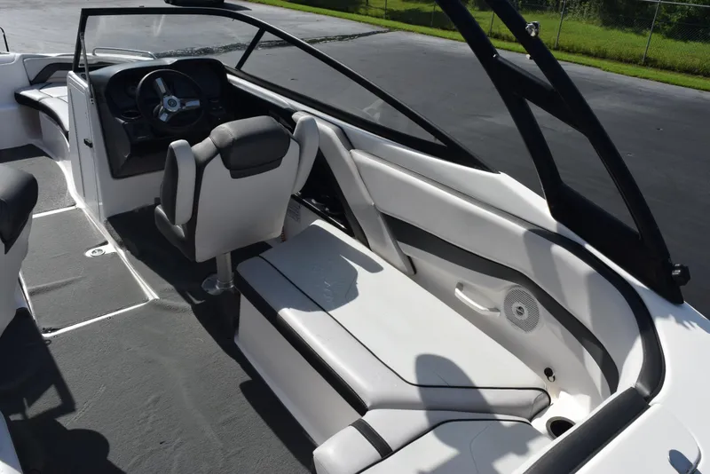 Slide: The Image of 2017 Yamaha AR240 boat interior with steering wheel and seating. - 9