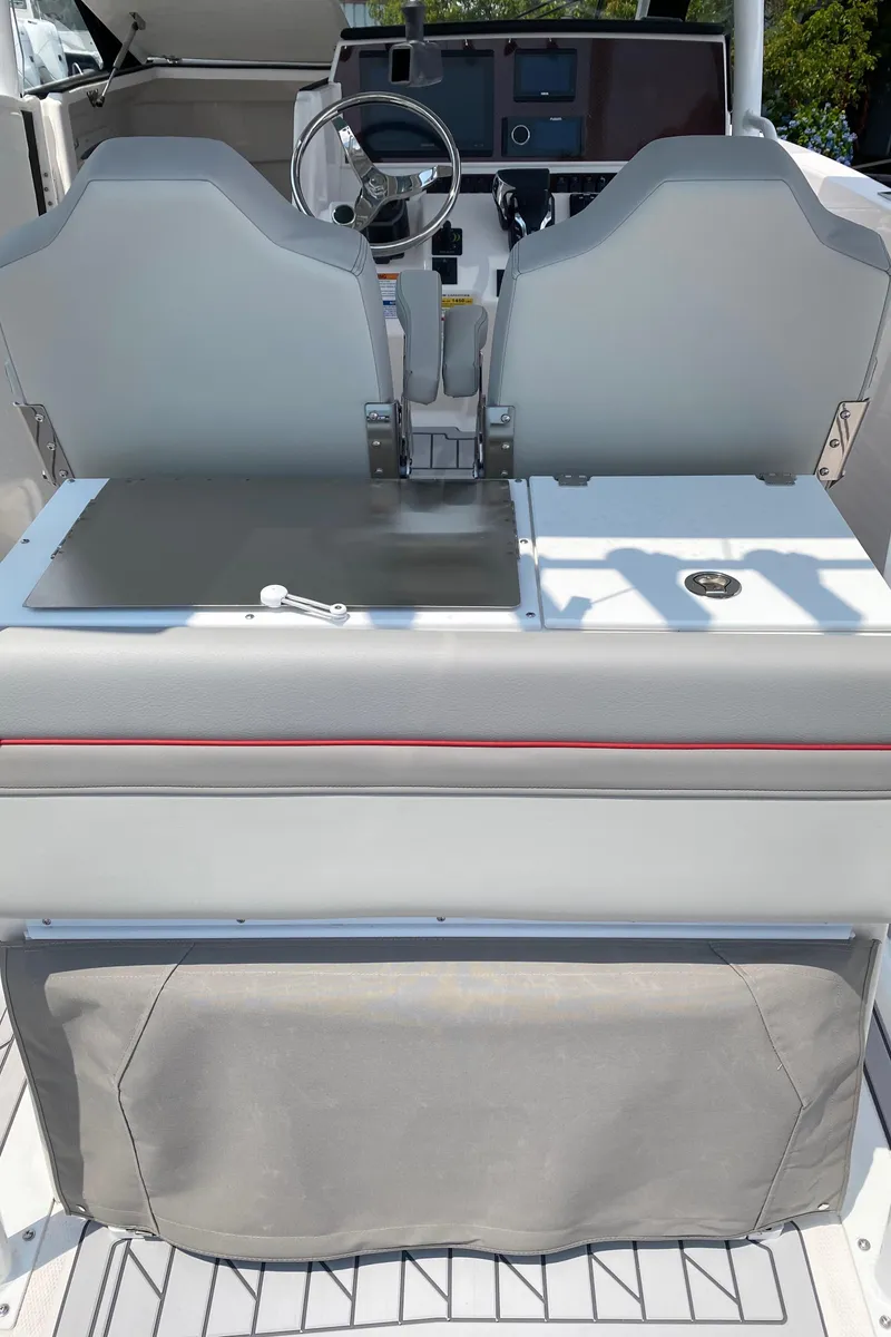Slide: The Image of 2025 Solara S-250 CW boat interior with dual seats and steering console. - 10
