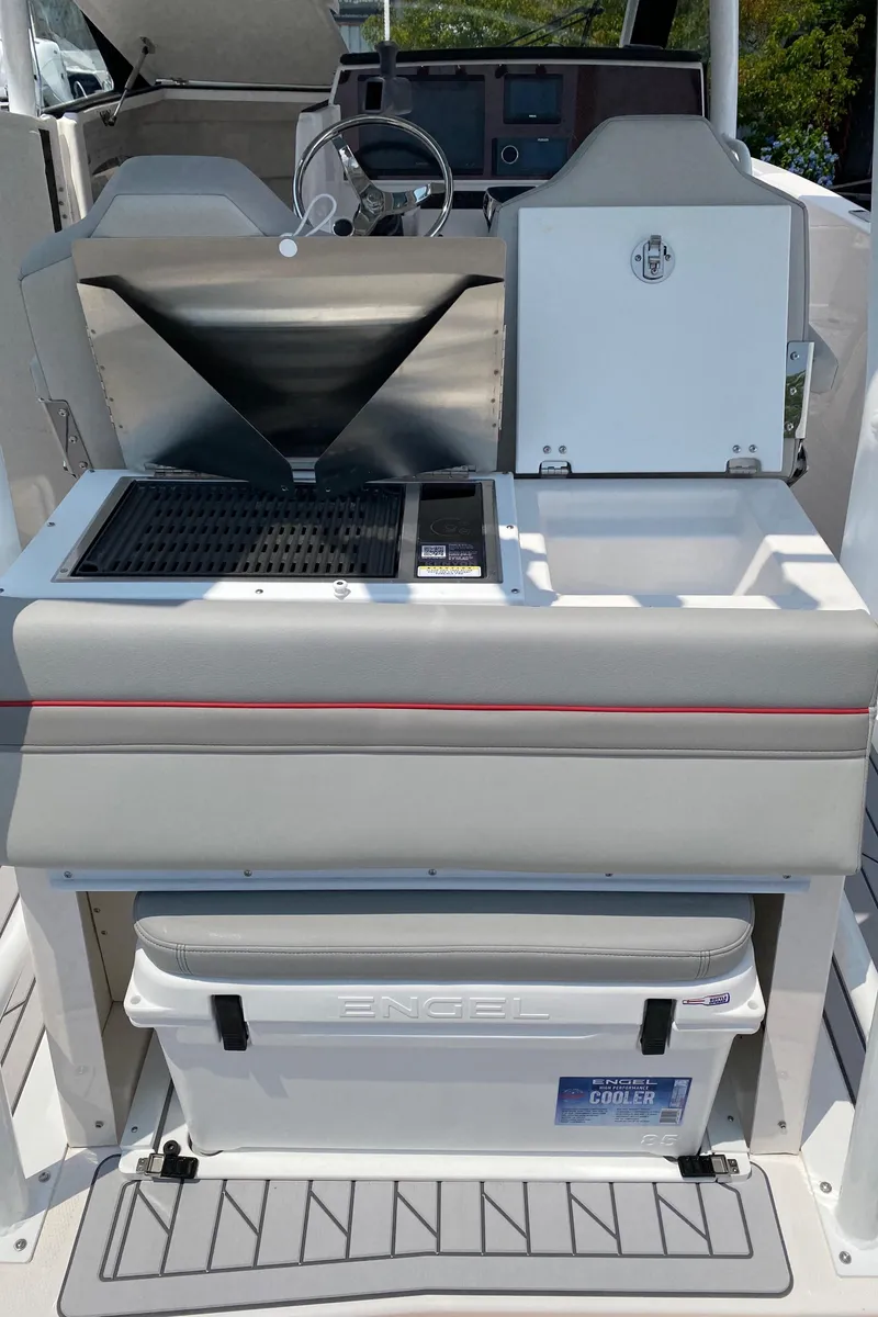 Slide: The Image of Solara S-250 CW 2025 boat interior with grill and Engel cooler. - 11