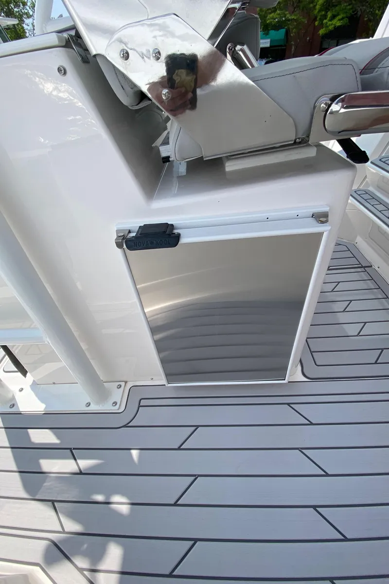 Slide: The Image of 2025 Solara S-250 CW boat interior with sleek flooring and modern console design. - 12
