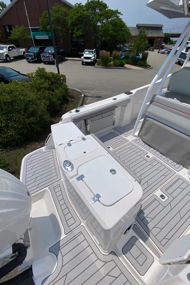 Slide: The Image of 2025 Solara S-250 CW boat deck with seating and storage compartments. - 15