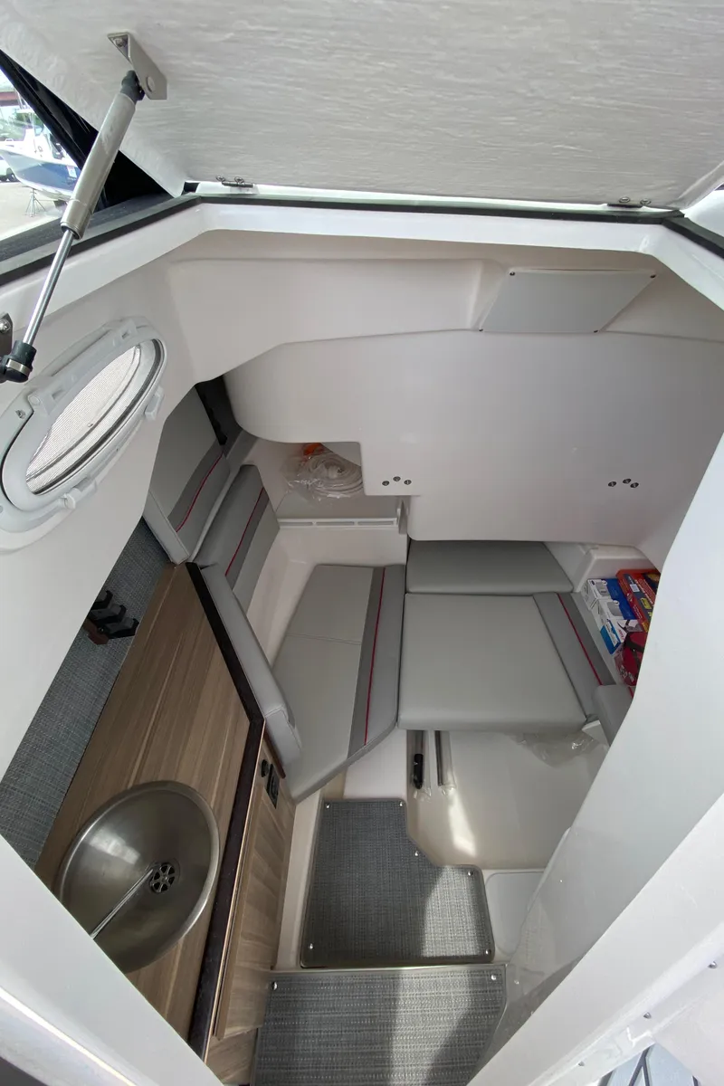 Slide: The Image of Interior cabin of 2025 Solara S-250 CW boat with seating and sink. - 21