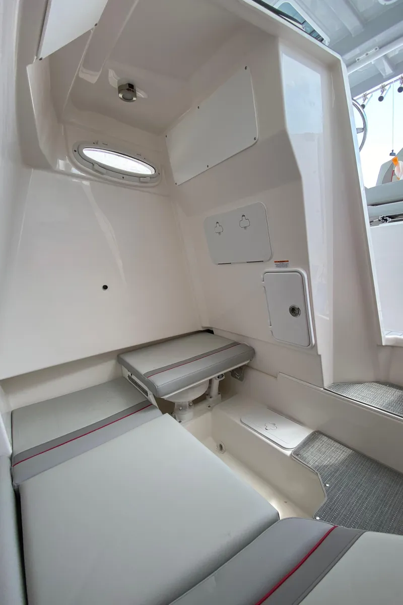 Slide: The Image of Interior cabin of 2025 Solara S-250 CW boat with seating and storage. - 23