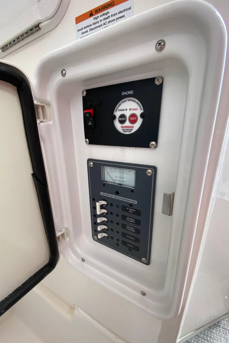 Slide: The Image of Electrical control panel in Solara S-250 CW 2025, featuring switches and voltage meter. - 25