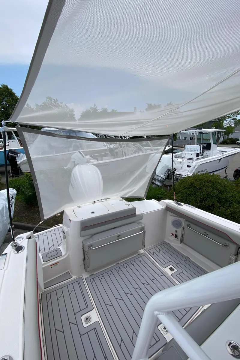 Slide: The Image of 2025 Solara S-250 CW boat interior with canopy, featuring sleek seating and modern design. - 6
