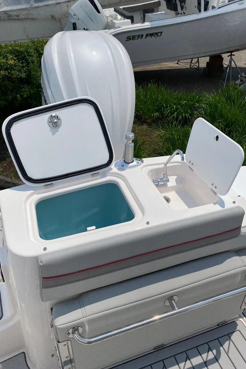 Slide: The Image of 2025 Solara S-250 CW boat with open storage compartment and sink on deck. - 8