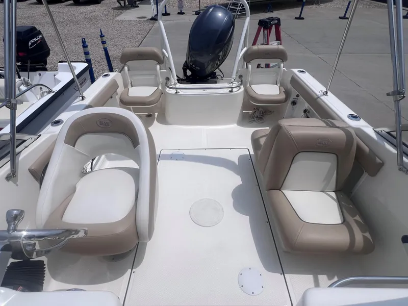 Slide: The Image of 2016 Key West 186 Dual Console boat interior with seating and motor. - 14