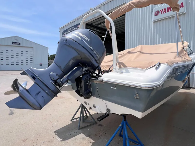 Slide: The Image of 2016 Key West 186 Dual Console boat with Yamaha outboard motor at marine facility. - 3