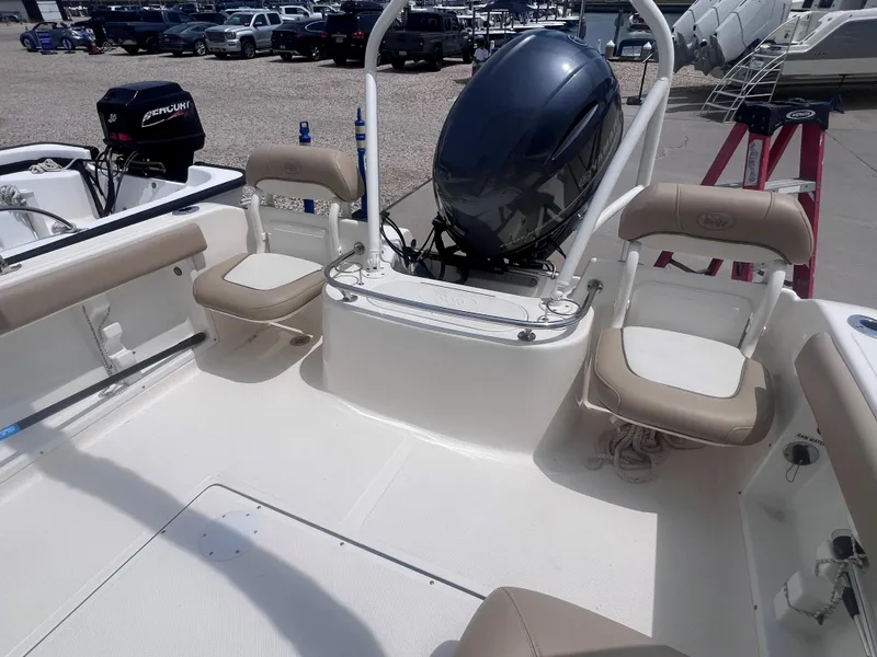 Slide: The Image of 2016 Key West 186 Dual Console boat interior with seating and outboard motor. - 6