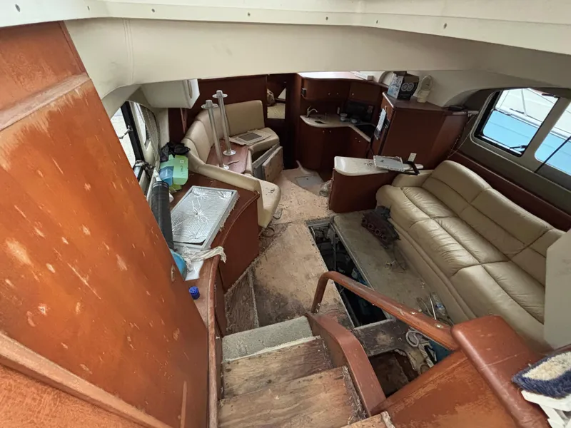 Slide: The Image of Interior of 2004 Silverton 35 Motor Yacht showing seating and cabin area. - 8