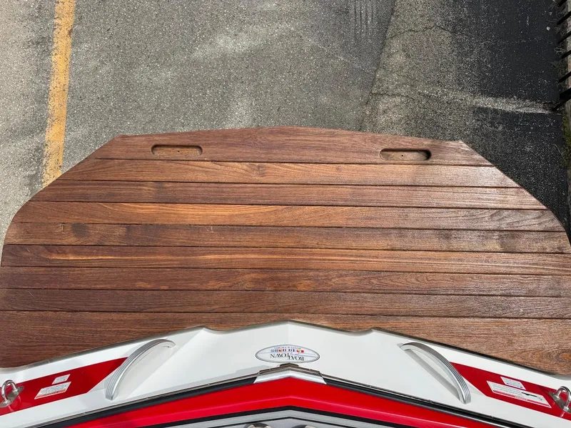 Slide: The Image of 2018 MasterCraft XT23 boat with wooden swim platform, viewed from above. - 4